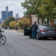 Detroit bicycle accident lawyer article image showing a cyclist near an open car door on a city street